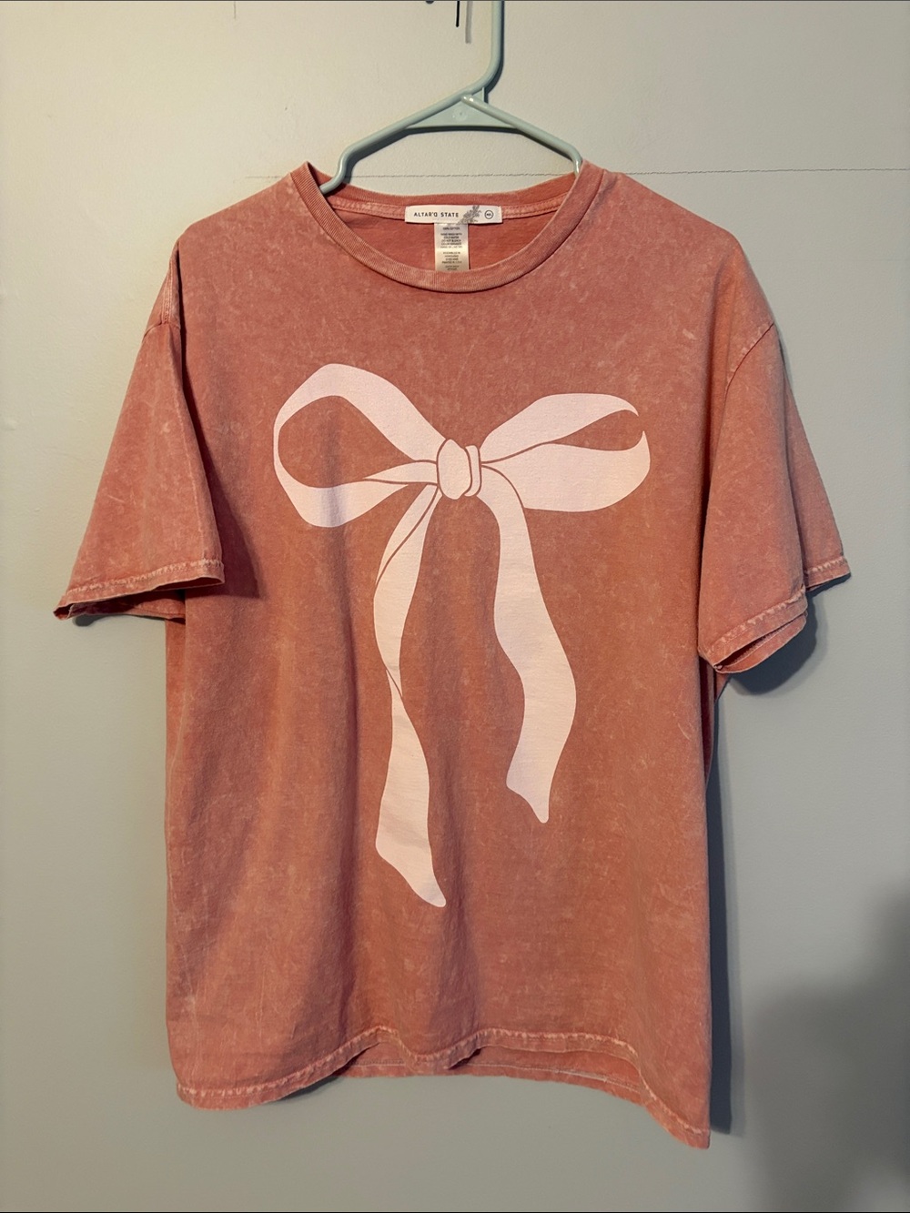 Altar'd State distressed Washed Rose Pink Short Sleeve Tee with Bow Graphic. M/L